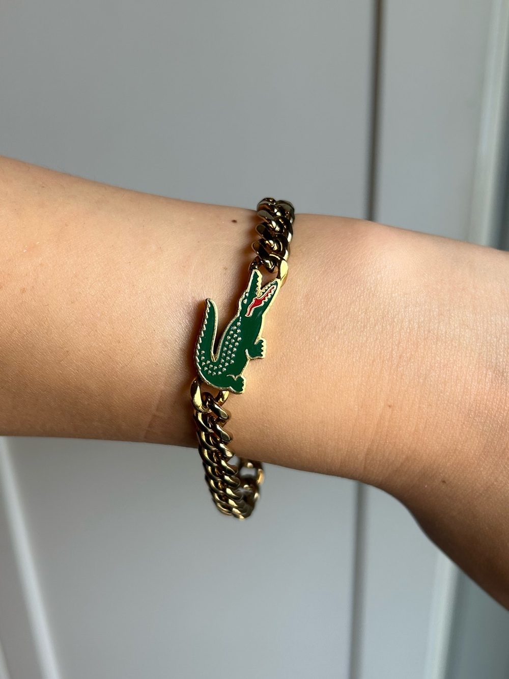 Unisex Lacoste Gold Plated Chain Bracelet with Green Crocodile Charm